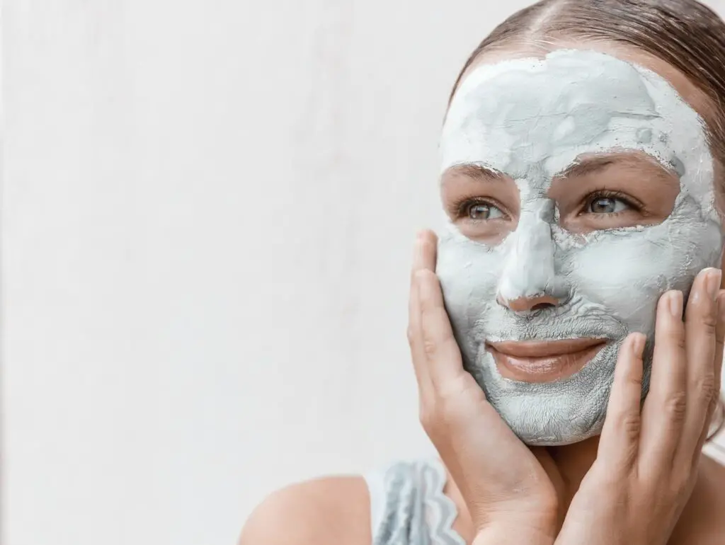 A close up of a woman with Moringa face mask